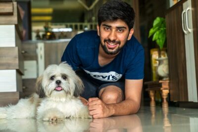 Man beside his Shih Tzu