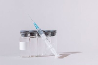 Vaccine Bottles and Syringe
