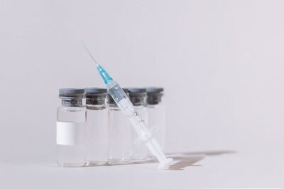 Vaccine Bottles and Syringe